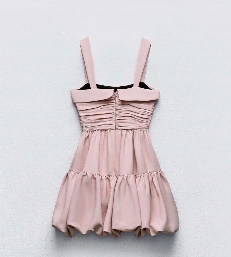 Zara Draped Balloon Pink Mini Dress (Category: Dresses) located in Quezon City. Submitted by kkaitly (Listing ID 1435825379, Image 2). Description: rfs: wrong size Please refer to zara’s size chart. retails php 2400+ Zara mini dress features a flattering ruched bodice and a playful, tiered bubble skirt. It has wide straps and a soft pink hue. The dress is designed with a unique bubble hem, adding a touch of flair. Perfect for a night out or a spe
