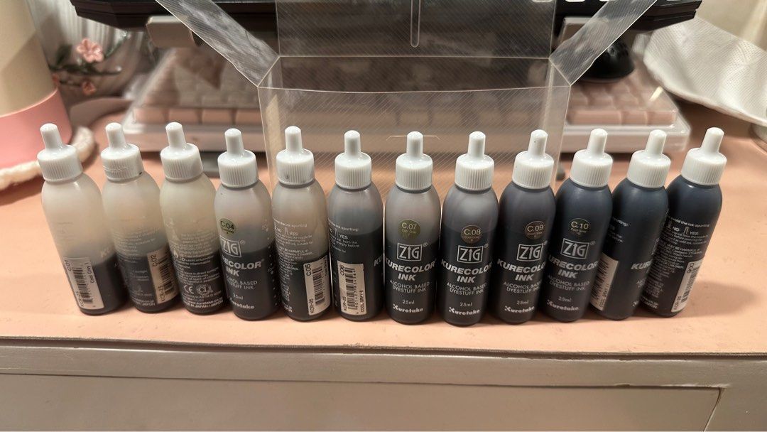 Zig Kurecolor Ink Refill Set (Cool Gray) (Category: Craft Supplies & Tools) located in Valenzuela. Submitted by gintoatlila (Listing ID 1435910121, Image 1). Description: Set Includes: 12 bottles (C01–C11 + Black) Condition: • 3 bottles are Brand New/Unopened • The rest are lightly used, with the lowest bottle (C01) at approximately 12mL (~50%) • Stored properly; bought July 2023.