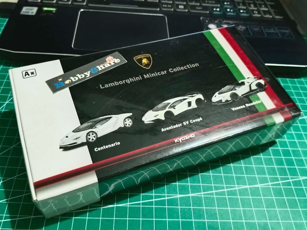 1:64 Kyosho Lamborghini Minicar Collection (Category: Vehicle & Diecast Models) located in General Trias. Submitted by hobbyshare19 (Listing ID 1440922443, Image 1). Description: Kyosho 1:64 Scale Lamborghini Minicar Collection (3-Car Box Set) Models Included: Centenario, Aventador SV Coupé, Veneno Roadster (All in White) Condition: 10/10 — MISB (Mint in Sealed Box) Factory Sealed. This is a rare, limited-edition release from the Kyosho Kuji (Lot