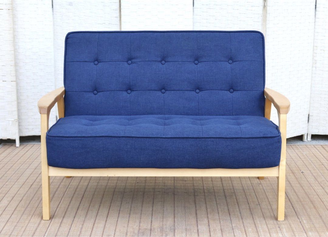 2-Seater Blue Fabric Sofa with Wooden Frame (Category: Sofas) located in Bulacan. Submitted by FurnitureGallery (Listing ID 1440890142, Image 1). Description: - Comfy 2-seater sofa - Upholstered in attractive blue fabric - Features button tufting on backrest and seat - Sturdy light-colored wooden frame - Ideal for small spaces or as a stylish accent piece - Comfortably seats two people - Easy-to-clean fabric JAPAN SURPLUS FURNITURE "Nitori" 2 SEA