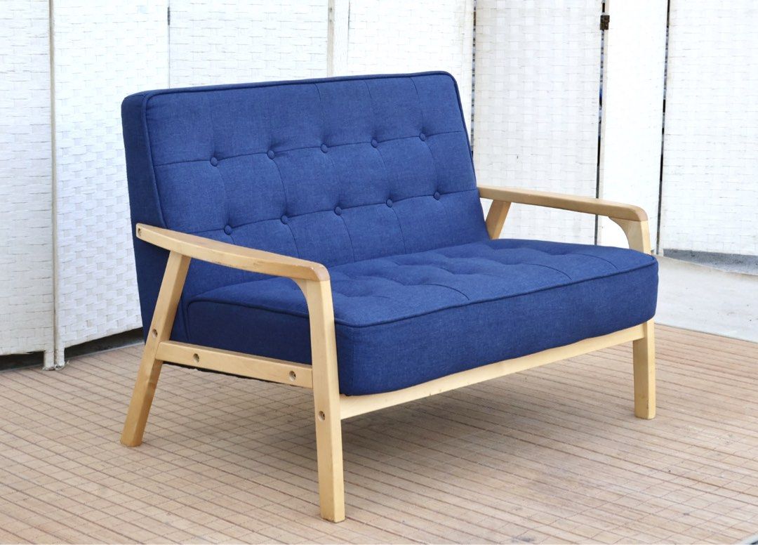 2-Seater Blue Fabric Sofa with Wooden Frame (Category: Sofas) located in Bulacan. Submitted by FurnitureGallery (Listing ID 1440890142, Image 2). Description: - Comfy 2-seater sofa - Upholstered in attractive blue fabric - Features button tufting on backrest and seat - Sturdy light-colored wooden frame - Ideal for small spaces or as a stylish accent piece - Comfortably seats two people - Easy-to-clean fabric JAPAN SURPLUS FURNITURE "Nitori" 2 SEA