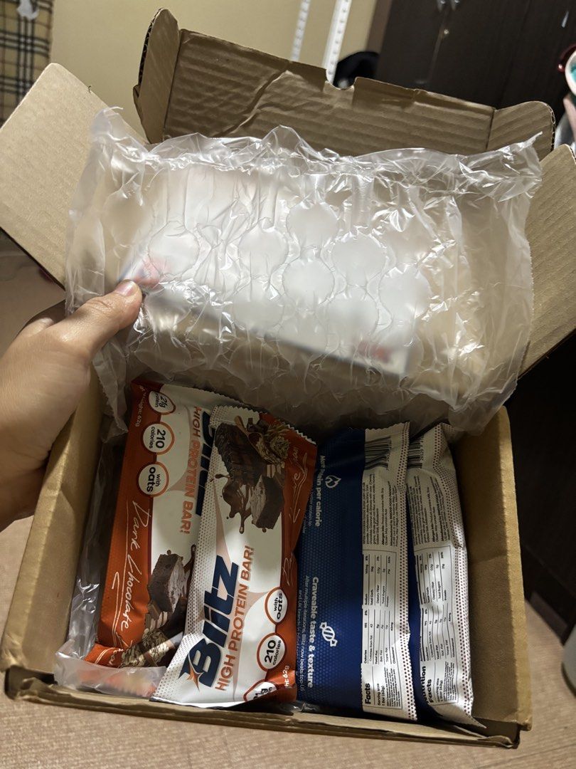 4 Bars With Box Blitz High Protein Bars - Dark Chocolate & Other Flavors (Category: Other Food & Drinks) located in Manila. Submitted by joahnaf (Listing ID 1440833666, Image 1). Description: - Blitz High Protein Bars - Flavors: Dark Chocolate & others - Expiry Dates: Good, some until 2026 - Ideal for quick snacks or post-workout fuel.