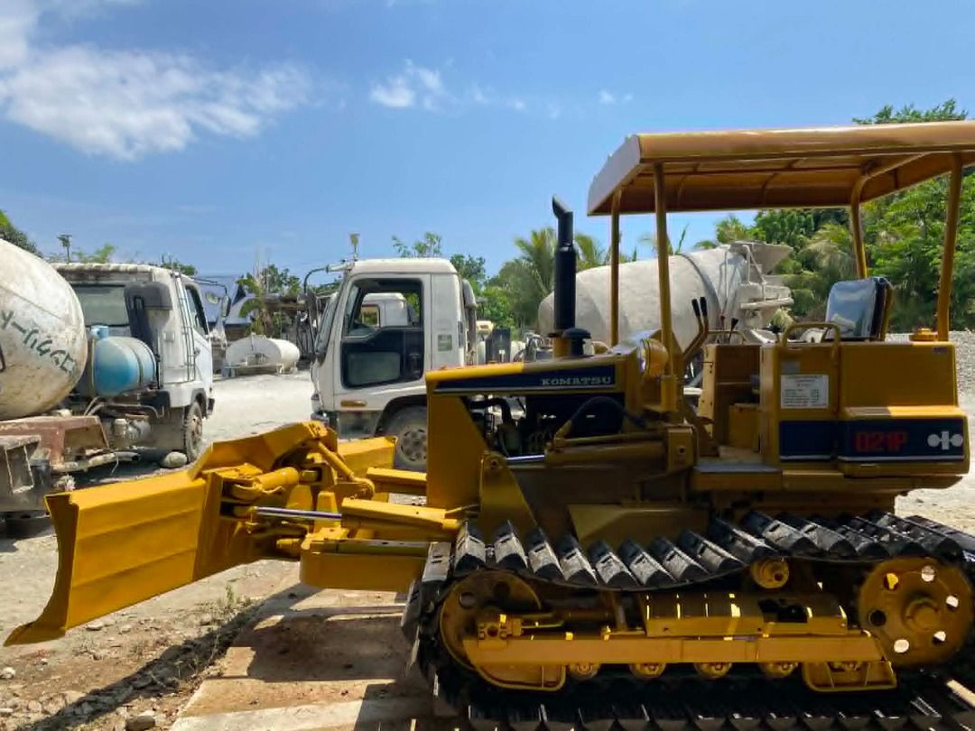 6-WAY KOMATSU BULLDOZER D2IP (Category: Construction Tools & Equipment) located in Caloocan City. Submitted by n.aibarra (Listing ID 1440819392, Image 2). Description: Model: Komatsu D21P-5 Blade Type: 6-Way (tilt, angle, lift) Undercarriage: Durable steel tracks for stability and traction Engine: Reliable Komatsu diesel engine — strong performance and fuel efficiency Operator Comfort: Open canopy with shade roof for visibility and protection Con