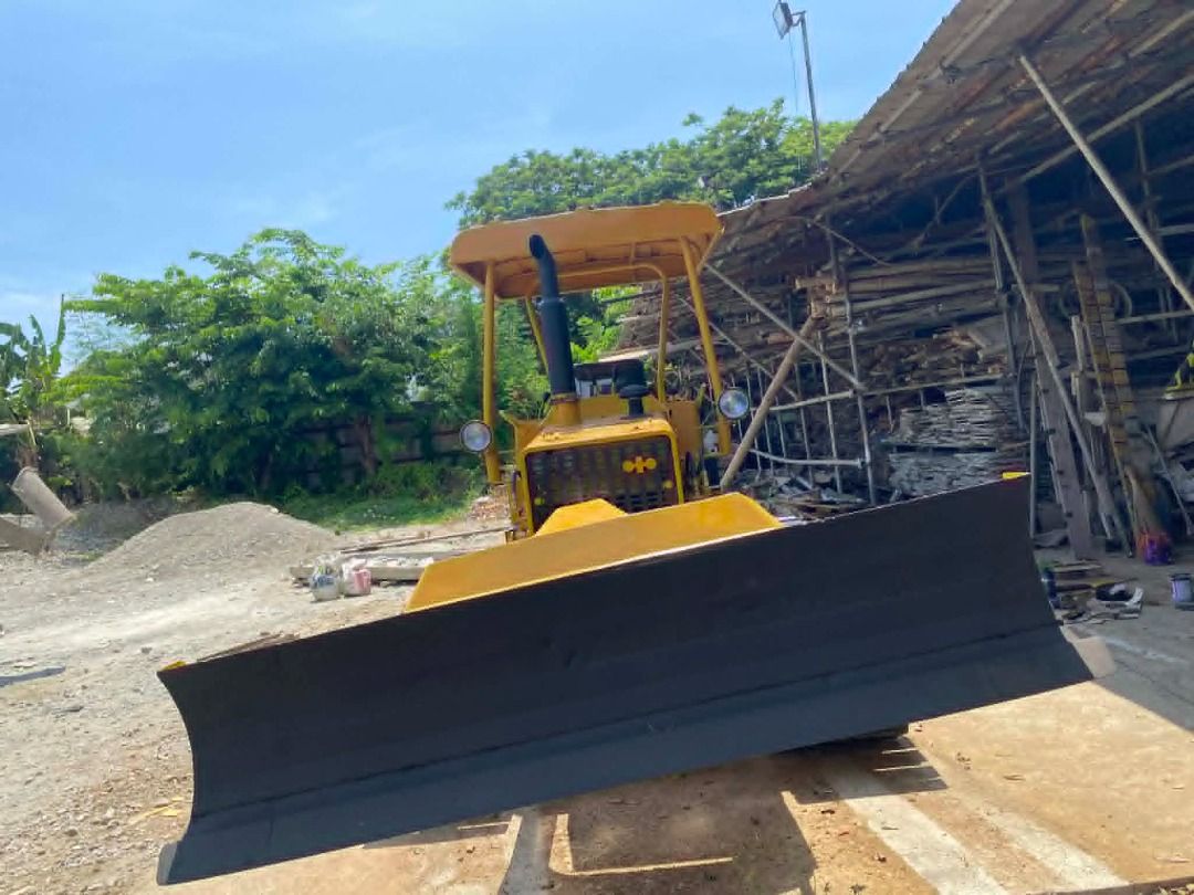 6-WAY KOMATSU BULLDOZER D2IP (Category: Construction Tools & Equipment) located in Caloocan City. Submitted by n.aibarra (Listing ID 1440819392, Image 3). Description: Model: Komatsu D21P-5 Blade Type: 6-Way (tilt, angle, lift) Undercarriage: Durable steel tracks for stability and traction Engine: Reliable Komatsu diesel engine — strong performance and fuel efficiency Operator Comfort: Open canopy with shade roof for visibility and protection Con