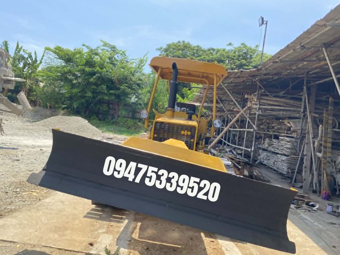 6-WAY KOMATSU BULLDOZER D2IP (Category: Construction Tools & Equipment) located in Caloocan City. Submitted by n.aibarra (Listing ID 1440819392, Image 1). Description: Model: Komatsu D21P-5 Blade Type: 6-Way (tilt, angle, lift) Undercarriage: Durable steel tracks for stability and traction Engine: Reliable Komatsu diesel engine — strong performance and fuel efficiency Operator Comfort: Open canopy with shade roof for visibility and protection Con