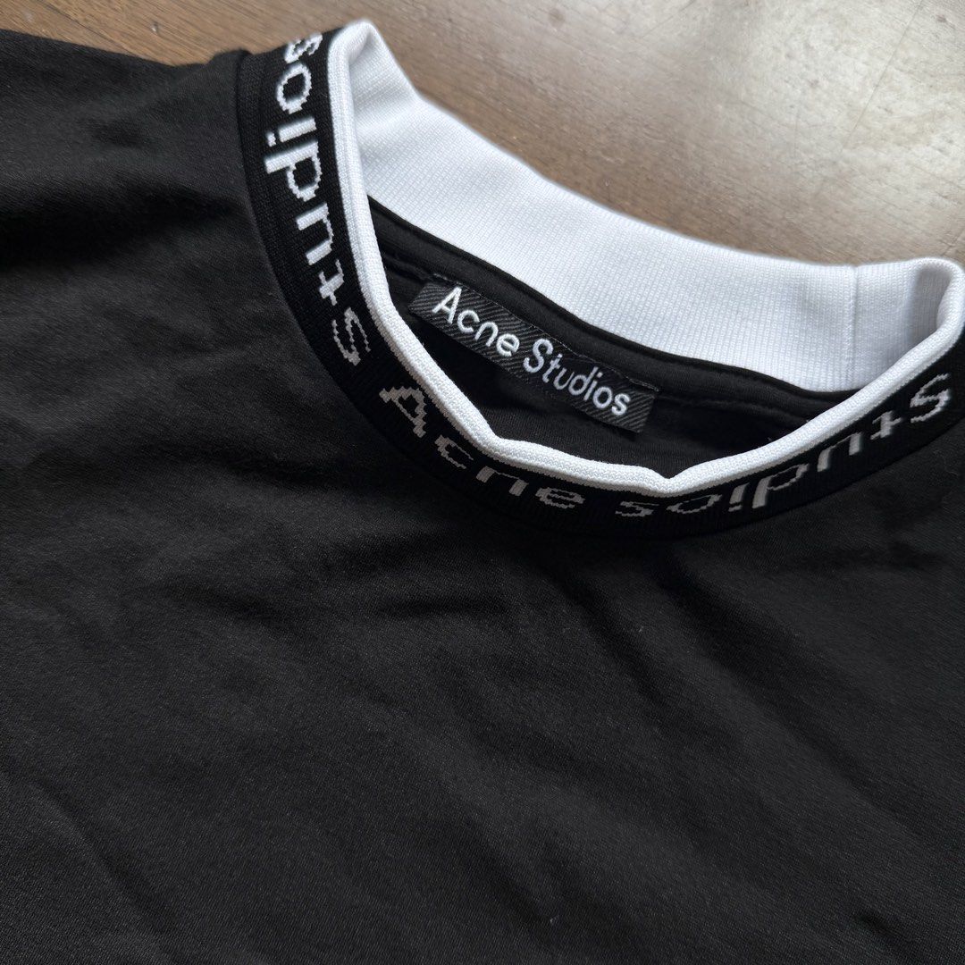 Acne Studios Black T-shirt with Logo Collar (Category: Tshirts & Polo Shirts ) located in Manila. Submitted by myclosetstylist (Listing ID 1440776976, Image 3). Description: - Brand: Acne Studios - Color: Black - Size: XS - Features: Acne Studios logo on collar band - Style: Classic staple piece for any wardrobe.