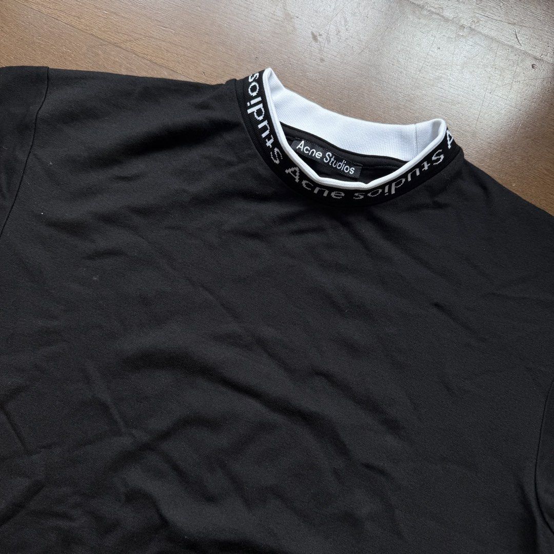 Acne Studios Black T-shirt with Logo Collar (Category: Tshirts & Polo Shirts ) located in Manila. Submitted by myclosetstylist (Listing ID 1440776976, Image 2). Description: - Brand: Acne Studios - Color: Black - Size: XS - Features: Acne Studios logo on collar band - Style: Classic staple piece for any wardrobe.