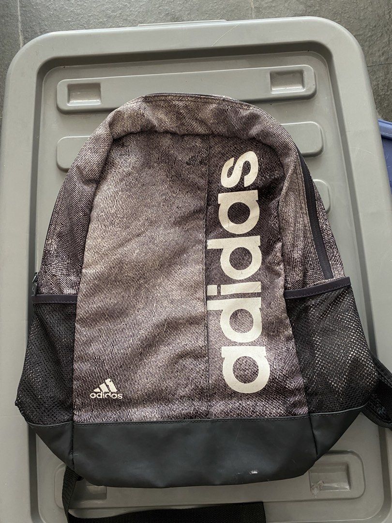 Adidas Backpack Grey Black White Logo (Category: Backpacks) located in Manila. Submitted by mpt99876 (Listing ID 1440865305, Image 1). Description: - Stylish Adidas backpack with a grey and black patterned design. - Features the iconic Adidas logo prominently on the front. - Convenient side mesh pockets for water bottles or essentials. - Adjustable straps for a comfortable, customized fit. - Perfect for school, work, or everyday adventures..