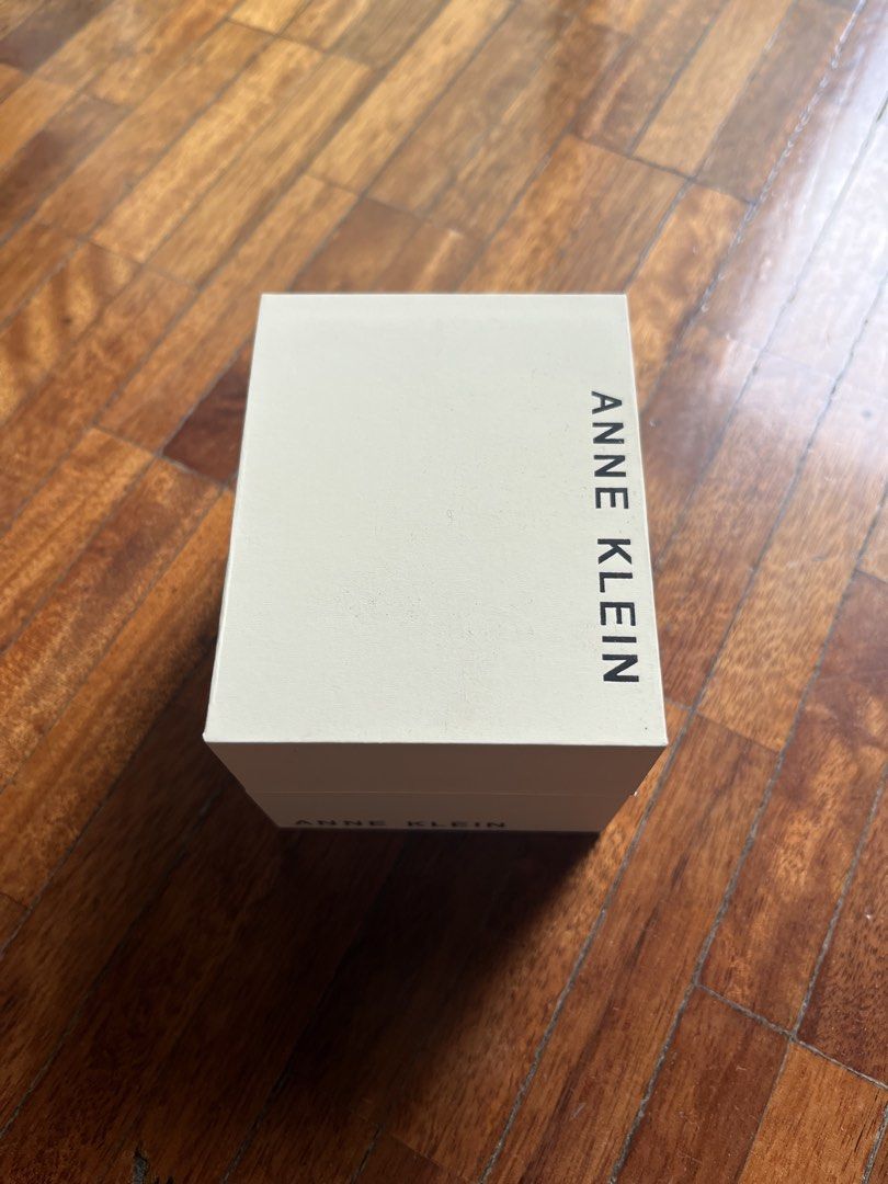 Anne Klein Rectangular Strap Watch - Rose Gold & Grey (Category: Women's Watches) located in Muntinlupa City. Submitted by projectnoclutter (Listing ID 1440806274, Image 2). Description: - Anne Klein rectangular watch - Rose gold tone case - Grey leather strap - Neutral taupe dial - Includes original box - Classic timepiece for everyday wear.