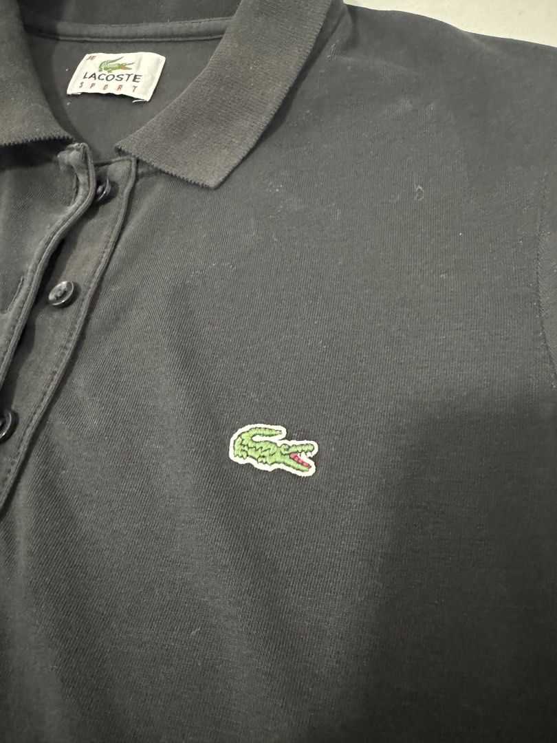 Authentic Lacoste Sport Black Polo Shirt (Category: Shirts) located in Imus. Submitted by oliviascents (Listing ID 1440888913, Image 3). Description: - Classic black Lacoste Sport polo shirt - Features iconic crocodile logo on chest - Button-up neckline with comfortable collar - Short sleeves - Ideal for casual wear or a sporty look W 15, L 25.
