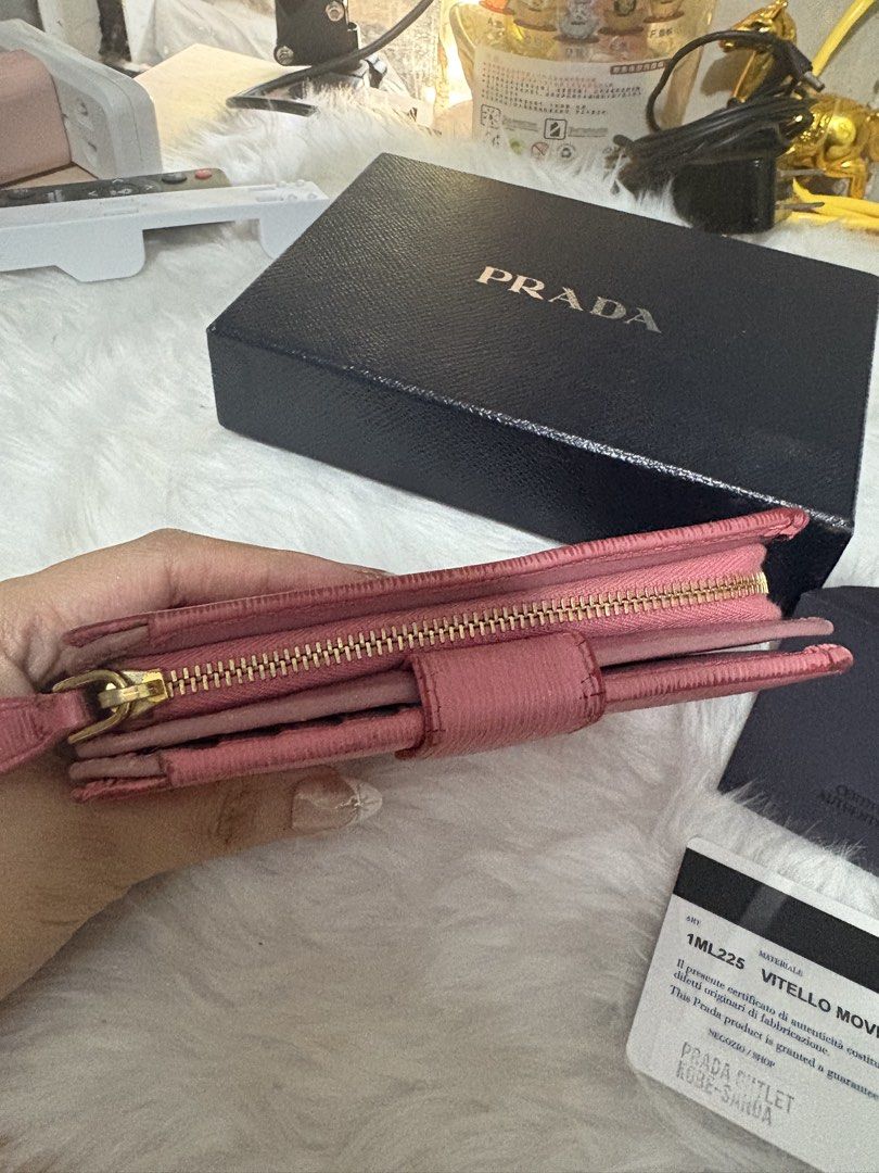 Authentic Prada (Category: Luxury Bags & Wallets) located in Quezon City. Submitted by preetycindz (Listing ID 1440801946, Image 2). Description: - Authentic Prada Wallet - Color: Geranio Pink - Material: Vitello Move Leather - Includes: Original Box, Authenticity Card - Closure: Zip Around - Features: Keeps essentials organized 100% authentic money back if proven fake sign of use only .