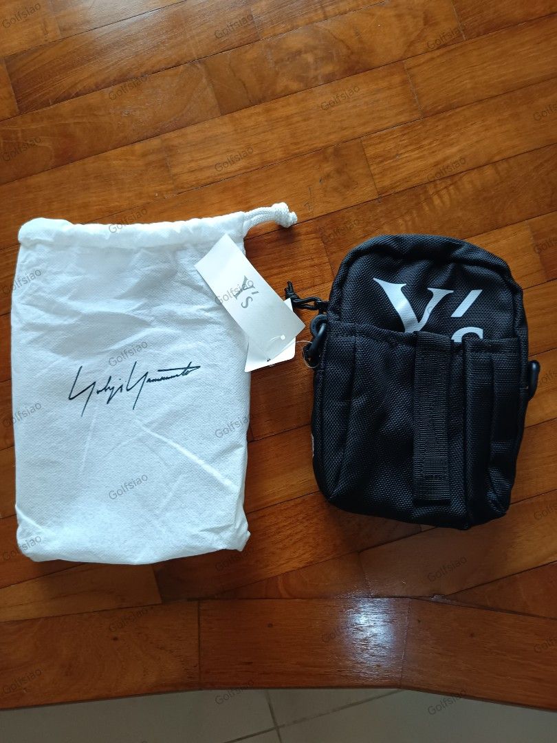 BAGS: ORIGINAL JAPAN YOHJI YAMAMOTO x NEW ERA Y'S SHOULDER BAG FOR SALE (Category: Sling Bags) located in Singapore. Submitted by golfsiao.travels. (Listing ID 1440910771, Image 1). Description: NOTE: 1) Pls read through and check out the pics closely. 2) No Return. No Refund. No Exchange. 3) When In Doubt, Pls Don't Buy. Reference Info: Price Tag indicated JPY9,000 (about SGD72). From Japan. Brand New with Tags and Labels. Official Colour: Black