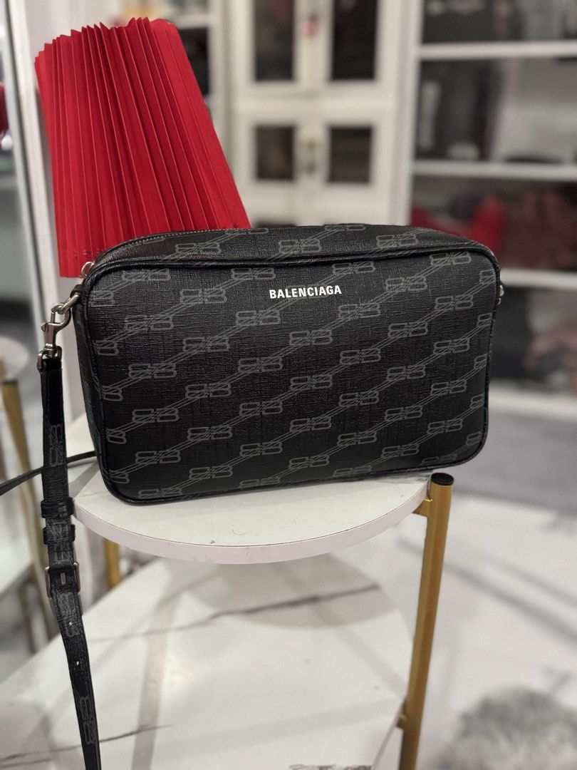 Balenciaga BB Monogram Camera Bag Black (Category: Luxury Bags & Wallets) located in Paranaque City. Submitted by shenarilyn (Listing ID 1440940567, Image 3). Description: - Authentic Balenciaga Camera Bag - Features iconic BB Monogram print - Color: Black with grey pattern - Accented with sleek silver hardware - Comes with original dust bag and shopping bag with receipt - Ideal for everyday style and convenience.