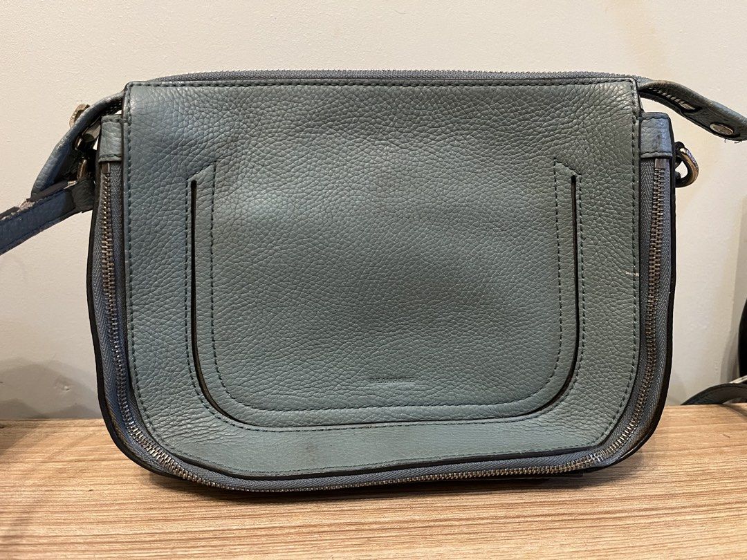 BEANPOLE Leather Crossbody Bag Light Blue (Category: Cross-body Bags) located in Quezon City. Submitted by metamerchant (Listing ID 1440917911, Image 2). Description: - Light blue BEAMPOLLE crossbody bag - Textured leather finish - Zipper closure (sides and top) - Adjustable strap with buckle - size: 9inches x 7.5inches - needs cleaning.