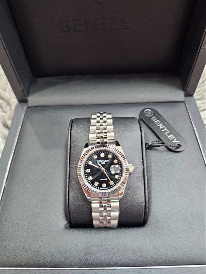 Bentley 1948 Sapphire Blue Dial Watch (Category: Luxury Watches) located in Manila. Submitted by shellador82390 (Listing ID 1440784562, Image 2). Description: - Bentley 1948 Watch - Stunning Sapphire Blue Dial - Elegant Diamond Hour Markers - Convenient Date Window - Durable Stainless Steel Band and Case - Includes Original Box - A Timeless Classic.