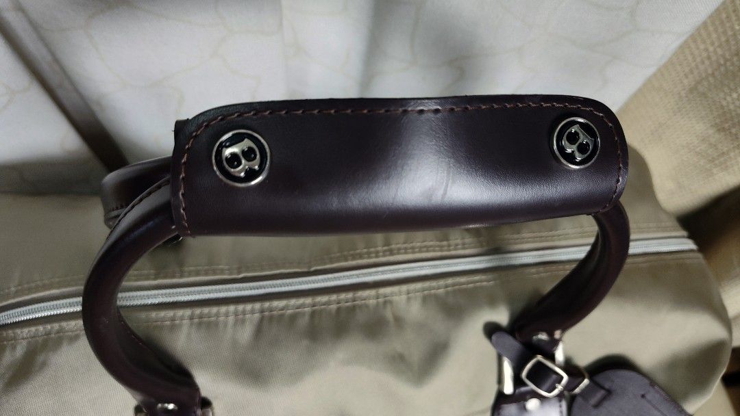 Bentley Duffle Bag Travel Weekender Bag (Category: Luxury Bags & Wallets) located in Quezon City. Submitted by edwinvuru (Listing ID 1440860613, Image 3). Description: - Bentley duffle bag - Ideal for weekend trips or carry-on luggage - Includes top handles and a detachable shoulder strap - Made with durable material - Ample interior space - Zippers feature the Bentley logo - Accented with dark brown leather.
