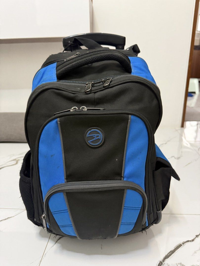Black and Blue Rolling Backpack with Telescopic Handle (Category: Backpacks) located in Quezon City. Submitted by lucialove (Listing ID 1440917243, Image 2). Description: - Hawk 5595 Large Backpack Stroller With Virupro Anti-Microbial Protection Black and blue rolling backpack - Telescopic handle for easy transport - Multiple zippered compartments for organization - Side mesh pockets - Minor scuffs and a small tear on one mesh pocket - Still full