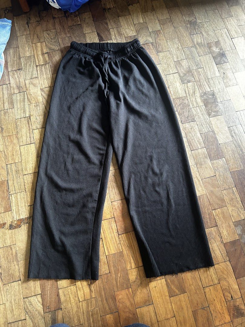 Black Ribbed Wide Leg Pants with Drawstring Waist (Category: Other Bottoms) located in Manila. Submitted by d.artchives (Listing ID 1440783827, Image 1). Description: - Black ribbed fabric - Wide leg cut - Elastic waistband with drawstring - Raw hem detail - Comfortable and casual for everyday wear.