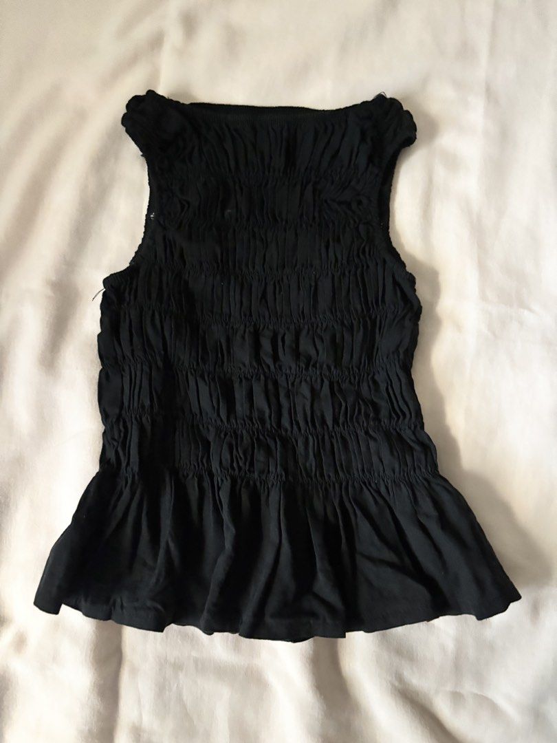 Black Ruched Sleeveless Peplum Top (Category: Sleeveless) located in Pasig City. Submitted by r_ain (Listing ID 1440860566, Image 3). Description: - Black sleeveless top - All-over ruched detailing - Used once only! - Fits best on S to M.