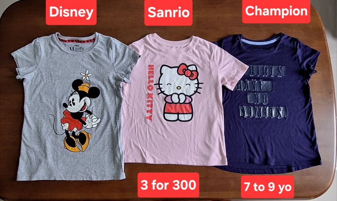 Branded T shirts for kids Brandnew & Preloved (Category: Babies & Kids Fashion) located in Naic. Submitted by blikitiplix (Listing ID 1440796588, Image 1). Description: - Assorted branded t-shirts for girls, suitable for ages 5-9 years. - Includes popular brands such as Disney, Sanrio, Champion, Adidas, Abercrombie, Gap, Old Navy, and Kandy Kiss. - Features a variety of designs including character prints (Minnie Mouse, Kitty), brand logos, stripe