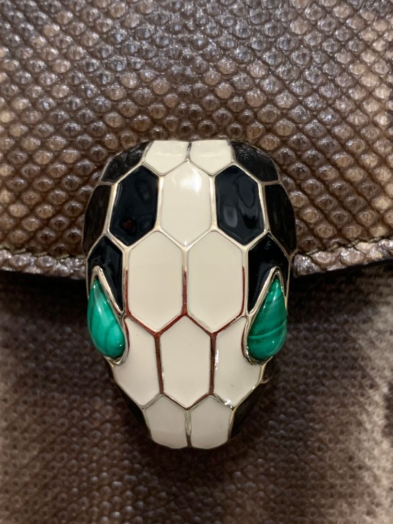Bvlgari Serpenti Forever shoulder bag (Category: Luxury Bags & Wallets) located in Quezon City. Submitted by mamaloveaminah (Listing ID 1440883321, Image 3). Description: - Authentic Bvlgari Serpenti Forever shoulder bag crafted from brown snake print karung leather with a snake head motif clasp. - Serial Number: FP.N12.35576 - Holographic authenticity sticker - Interior: Pink fabric - Exterior: Beige/Gold tone - Closure: Zipper.
