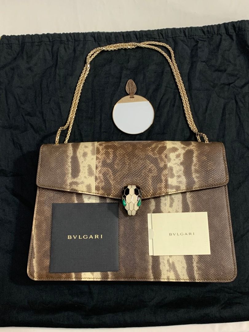 Bvlgari Serpenti Forever shoulder bag (Category: Luxury Bags & Wallets) located in Quezon City. Submitted by mamaloveaminah (Listing ID 1440883321, Image 1). Description: - Authentic Bvlgari Serpenti Forever shoulder bag crafted from brown snake print karung leather with a snake head motif clasp. - Serial Number: FP.N12.35576 - Holographic authenticity sticker - Interior: Pink fabric - Exterior: Beige/Gold tone - Closure: Zipper.