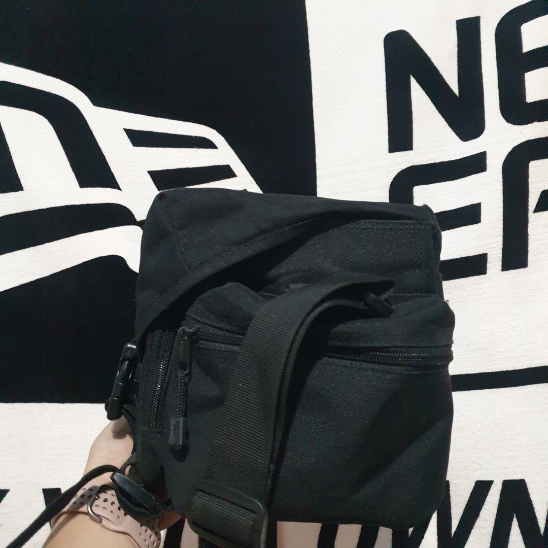 Canon Black Camera Bag with Adjustable Straps (Category: Camera Bags & Carriers) located in Barotac Nuevo. Submitted by ehsherjohn27 (Listing ID 1440774737, Image 2). Description: - Black Canon camera bag - Multiple interior compartments for organization - Adjustable straps for comfortable carrying - Zippers in good working order - Ideal for photographers on the go.