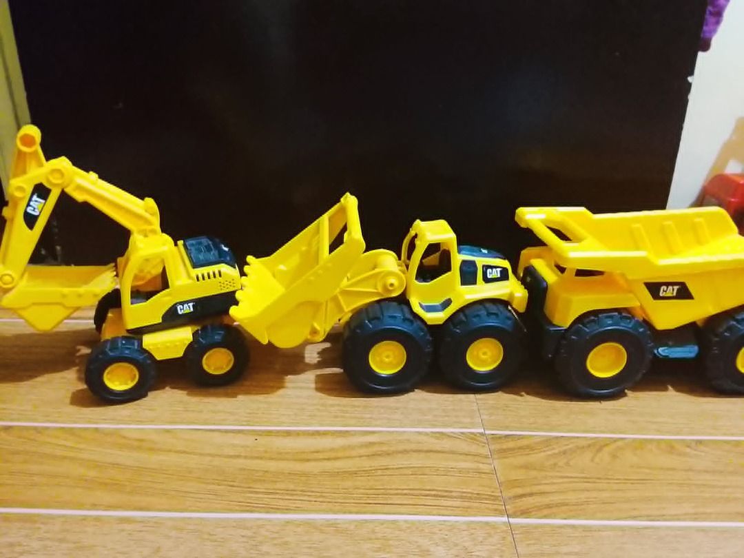 CAT and other toy construction vehicles set (Category: Kids Toys) located in Quezon City. Submitted by gracieloves09 (Listing ID 1440949322, Image 3). Description: Please help me declutter my youngest son's toys. In Good condition po lahat unless stated otherwise. Small Fire Truck 300 Big Fire Truck (gray ladder) 500 Giant Fire Truck (with yellow ladder) 1K CAT big bulldozer 500 CAT small construction vehicles 1200 (all three) Colorful dumper/fro