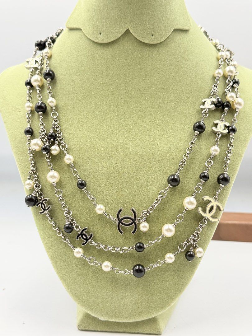 CHANEL B11C Necklace (Category: Luxury Accessories) located in Baguio. Submitted by manang_isang (Listing ID 1440905929, Image 1). Description: Chanel B11C Necklace features an iconic CC logo and a beautiful combination of black and white costume pearls. Originating from the 2011 Cruise Collection, this piece mixes vintage-style pearls with signature Chanel branding, making it a highly sought-after collector’s.