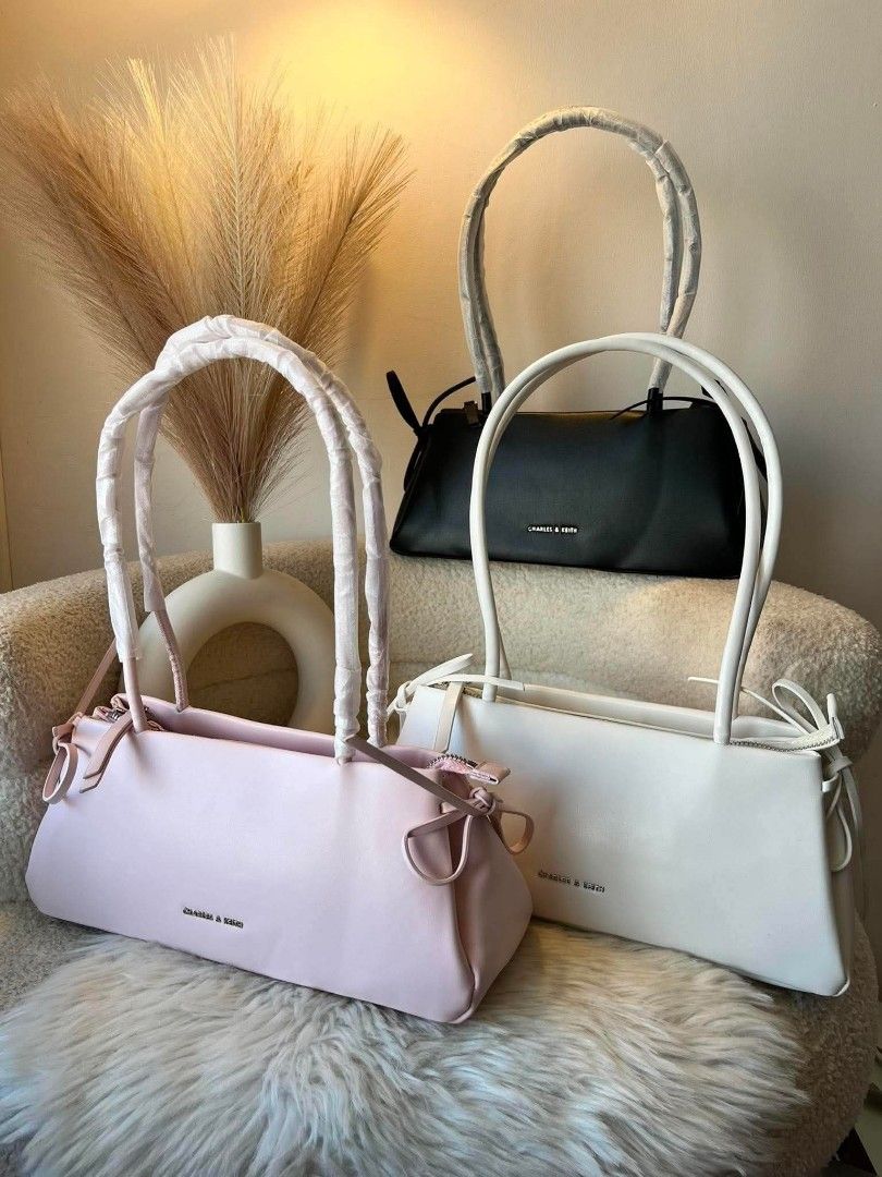 Charles & Keith Shoulder Bag - Pink, White, Black (Category: Shoulder Bags) located in Manila. Submitted by jocelynesc26472 (Listing ID 1440912383, Image 1). Description: - Brand: Charles & Keith - Style: Shoulder Bag - Available Colors: Pink, White, Black - Unique Feature: Knotted strap detail - Size: Perfect for daily essentials.