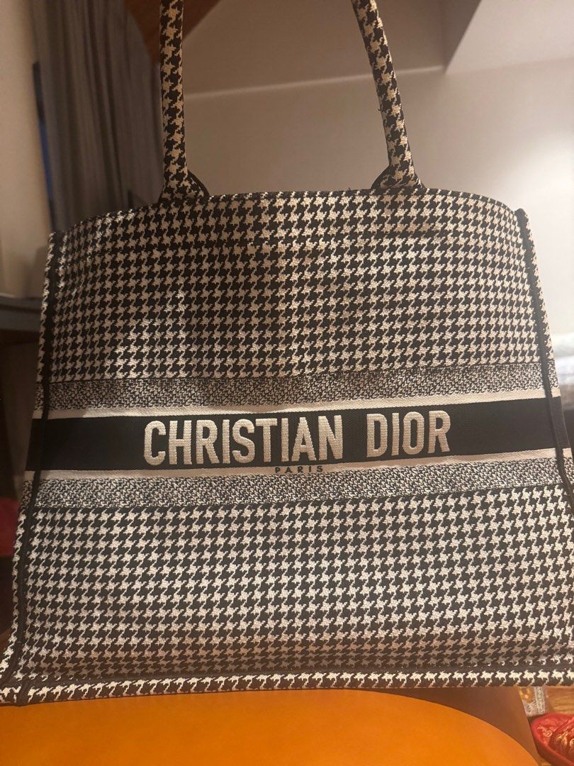 Christian Dior Houndstooth Book Tote Bag (Category: Luxury Bags & Wallets) located in Quezon City. Submitted by annsapp (Listing ID 1440871222, Image 1). Description: - Authentic Christian Dior tote bag - Classic houndstooth pattern - Features Christian Dior Paris logo on the front - Made in Italy - Purchased in Europe - Spacious interior - Ideal for everyday use or travel RFS: Too many bags.