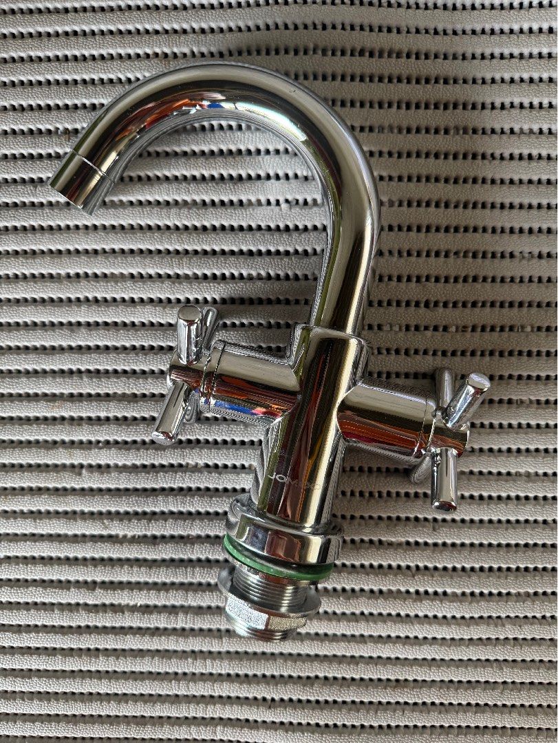 Chrome Kitchen Faucet with Double Cross Handles (Category: Bathroom & Kitchen Fixtures) located in Bacolod City. Submitted by swagspot (Listing ID 1440855186, Image 2). Description: - Sleek chrome finish - Dual cross handles for easy control - Swivel spout for added convenience - Standard top fitting, ready for installation - Ideal for kitchen sinks or utility areas - Clean and shiny appearance.