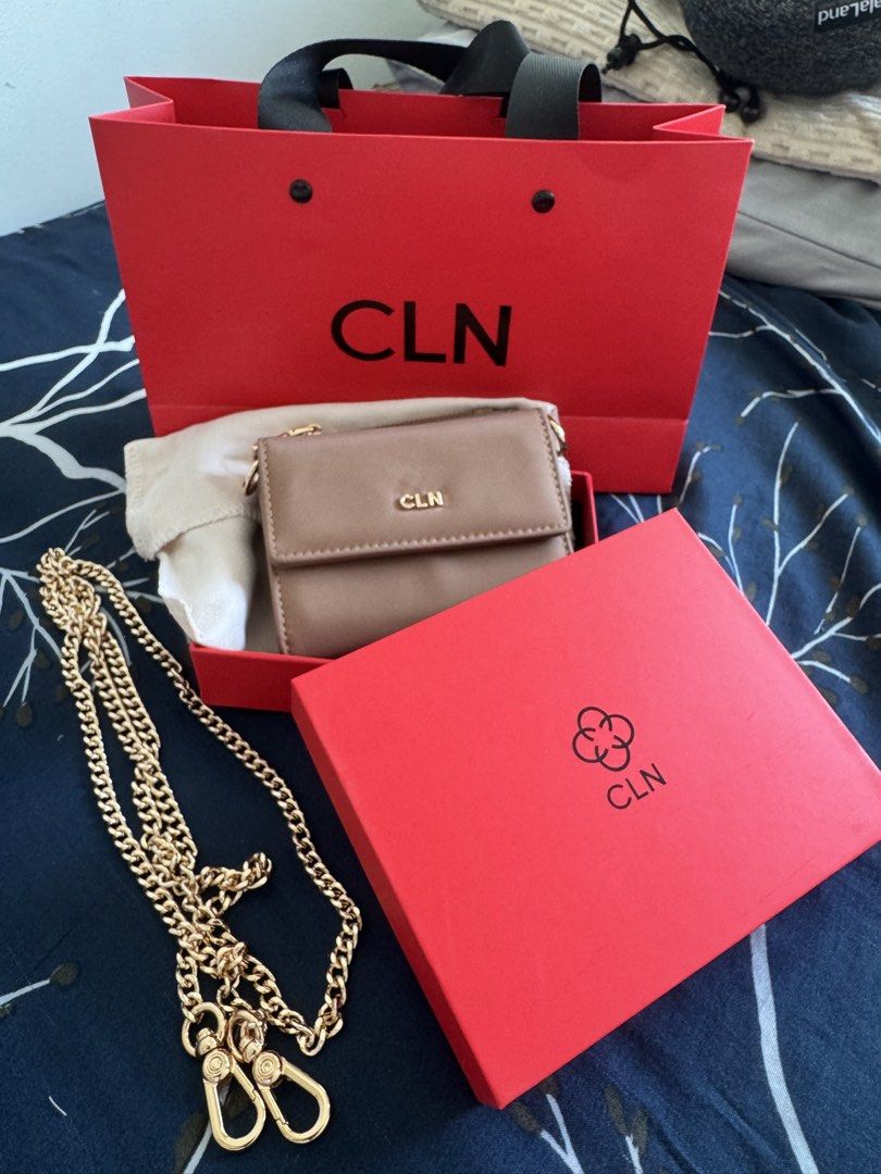 CLN Brown Wallet with Chain and Card Holder (Category: Wallets & Card holders) located in Makati City. Submitted by danittt (Listing ID 1440808025, Image 1). Description: Brown CLN wallet. Comes with a gold chain strap and a matching card holder. Has multiple card slots inside and a key holder. Includes the original CLN dust bag, red box, and shopping bag. Great for carrying essentials. RFS: Decluttering .
