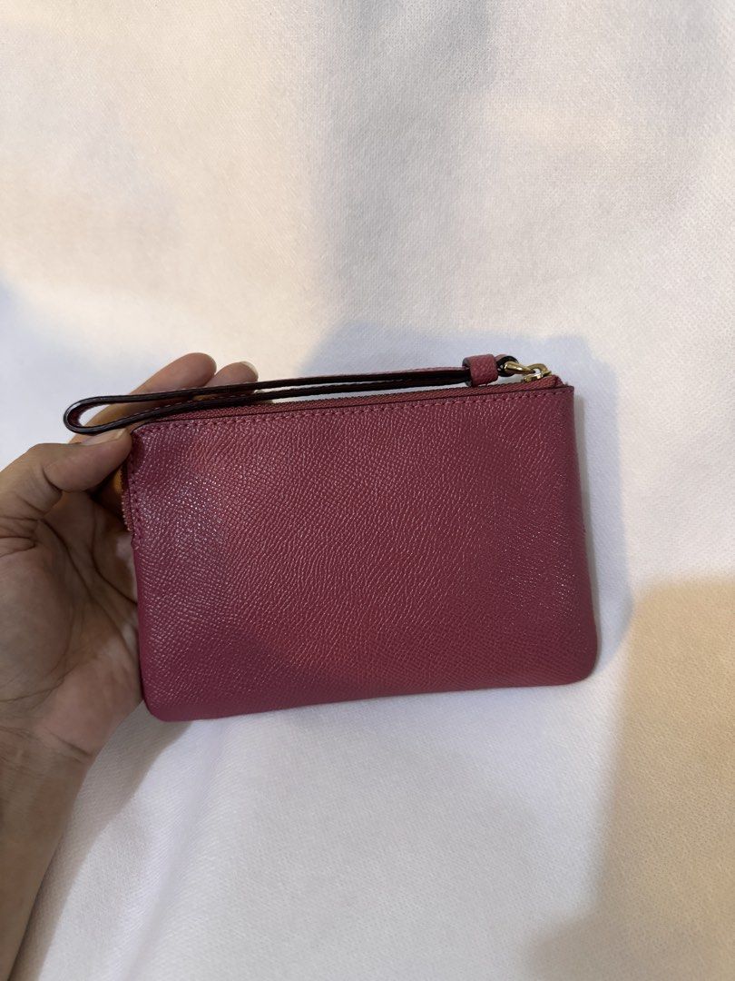 Coach Pink Leather Wristlet Pouch with Strap (Category: Purses & Pouches) located in Davao. Submitted by stellietas (Listing ID 1440858685, Image 2). Description: ✨Good condition, minimal signs of use only. Clean interior. ✨Size: 6.25L x 4.25W inches ✨First to pay gets it. ✨💯 % original or money back ✨Japan preloved.