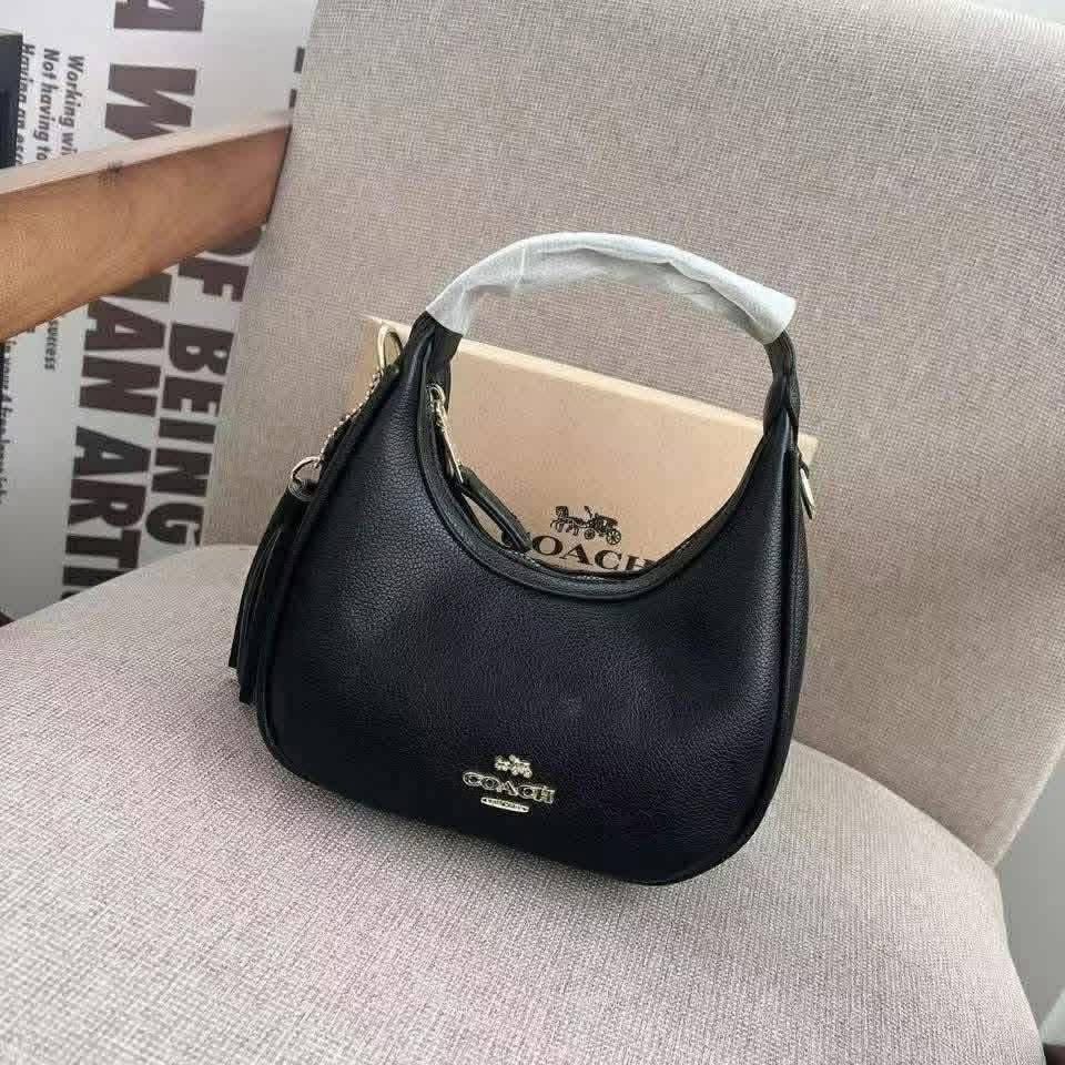 Coach Signature Hobo Shoulder Bag (Category: Luxury Bags & Wallets) located in Manila. Submitted by coachluxurybag (Listing ID 1440831072, Image 3). Description: - Coach hobo bag - Signature print available in brown or pink - Plain black leather option also available - Features a stylish tassel detail - Ideal for everyday use - Fits all your essentials - Comes with a dust bag.