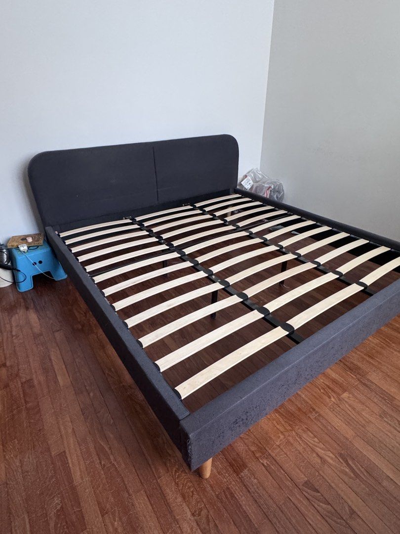 Dark Grey Fabric Kibg Size Bed Frame with Wooden Slats (Category: Bed Frames & Mattresses) located in Singapore. Submitted by gerrybt (Listing ID 1440772211, Image 2). Description: - Dark grey fabric bed frame - Includes wooden slats for mattress support - Modern and simple design - Originally from company call NOA. - Perfect for any bedroom - 194 x 205 cm - some scratches but in good condition.