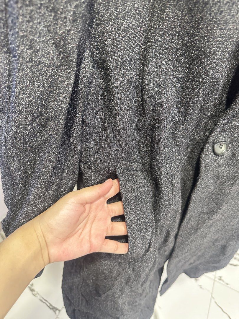 Dark Grey Textured Long Coat (Category: Coats, Jackets and Outerwear) located in Bulacan. Submitted by elyjgpreloved (Listing ID 1440873132, Image 2). Description: Fits up to large - Dark grey textured long coat - Button-up front with two visible buttons - Features front pockets - Button details on the cuffs - Ideal for cooler weather - Simple and classic design.