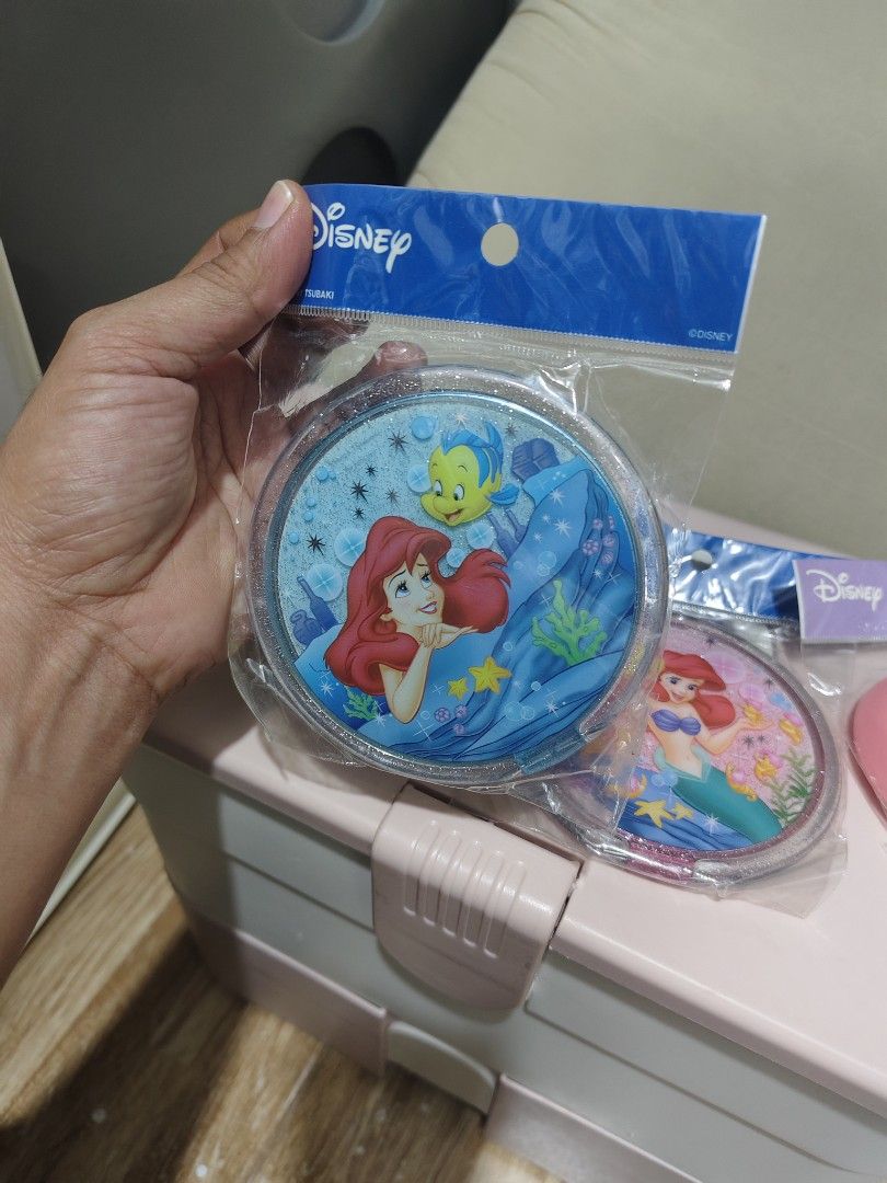 Disney Ariel & Friends Compact Mirrors & Puff Set (Category: Mirrors) located in Makati City. Submitted by abegailbrezuela (Listing ID 1440821003, Image 2). Description: - Set includes Disney compact mirrors featuring Ariel and Flounder. - Comes with a pink Tinkerbell-designed makeup puff. - All items are brand new and sealed in original packaging. - Ideal for Disney enthusiasts and collectors. - Perfect for convenient makeup touch-ups anytime, a