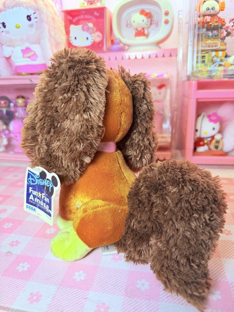 Disney Fun Fan Amuse SEGA Mimi (Category: Plushies & Soft Toys) located in Caloocan City. Submitted by fluffy.stuff10 (Listing ID 1440765874, Image 2). Description: - Adorable Disney plush dog - From SEGA's Fun Fan Amuse line - Features soft, fluffy brown fur - Adorned with a big pink satin bow - Ideal for Disney collectors - Makes a wonderful gift - Perfect for cuddling!.