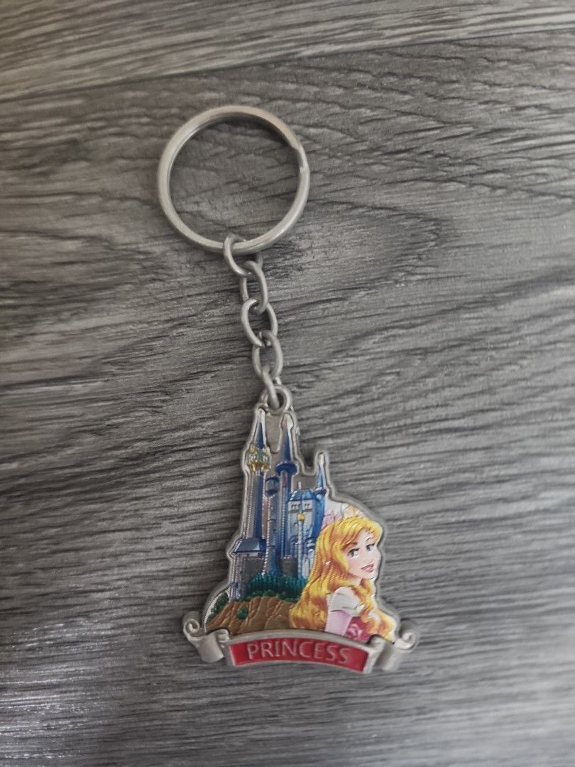 Disney Princess Sleeping beauty keychain (Category: Charms) located in Muntinlupa City. Submitted by ericres (Listing ID 1440804087, Image 1). Description: price can be bargained - metal chain and ring, slight rusting - disney copyright .