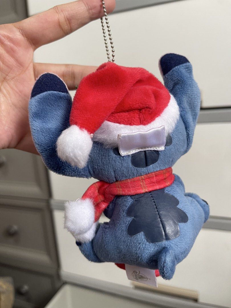 Disney Store Stitch Christmas Plush Keychain (Category: Plushies & Soft Toys) located in Arayat. Submitted by imeon13 (Listing ID 1440935183, Image 2). Description: - Adorable Stitch plush keychain from Disney Store. - Festive Christmas design: includes Santa hat and scarf. - Features a cute stocking detail. - Ideal for decorating bags, backpacks, or as a holiday accessory. - A must-have for any Stitch enthusiast!.
