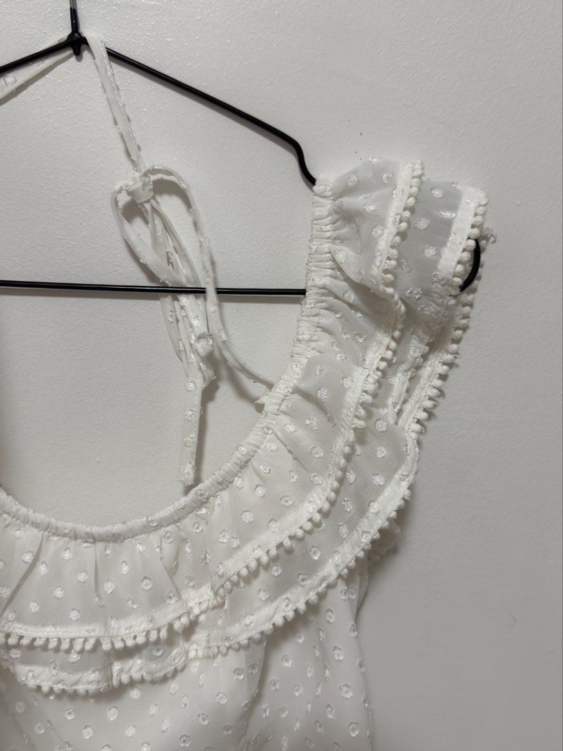 Forever 21 White Off-Shoulder Ruffle Crop Top (Category: Others Tops) located in Cabanatuan. Submitted by midaxadim (Listing ID 1440876935, Image 3). Description: - White off-shoulder crop top - Brand: Forever 21 - Features: Swiss dot pattern, ruffled trim, pom-pom details -Small on tag pero fits like XS po.