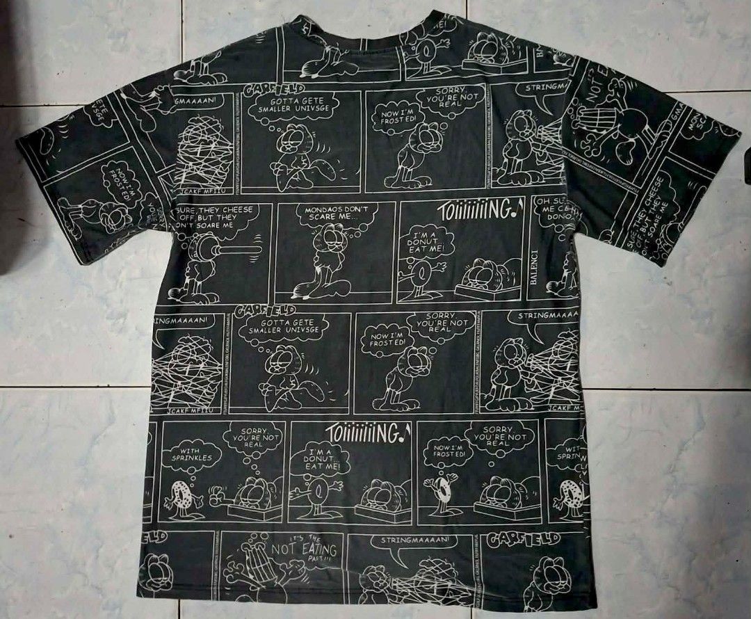 Garfield by Fun Graphic T-Shirt (Category: Tshirts & Polo Shirts ) located in Quezon City. Submitted by liaaaaaamm (Listing ID 1440941517, Image 2). Description: W: 24 L: 31.5 manipis fabric like polyester.