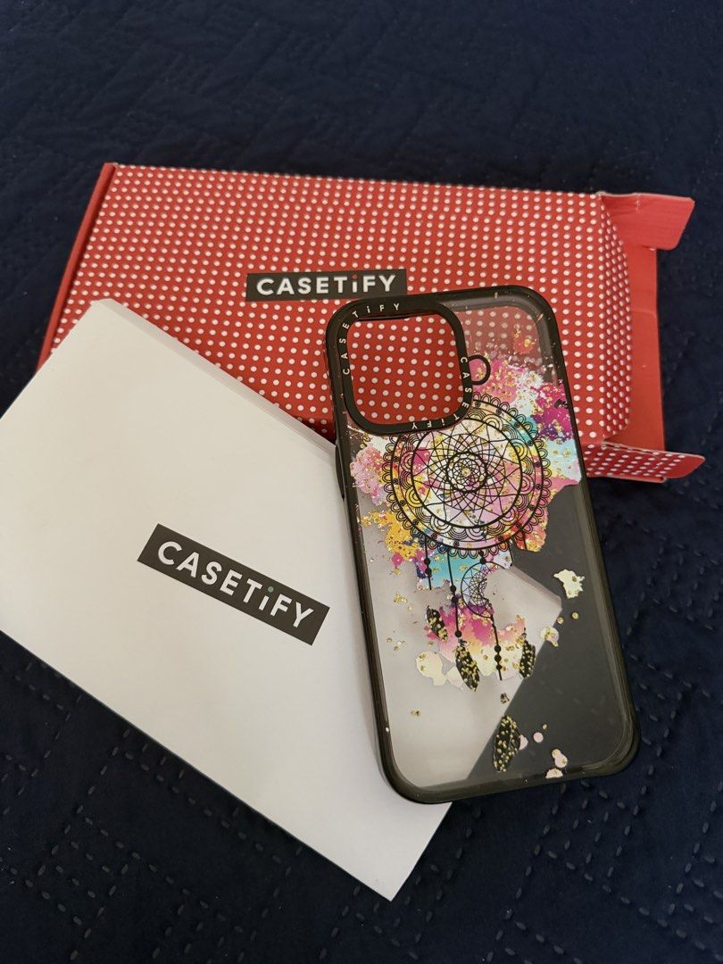 Genuine Casetify Impact Case for iPhone 15 Pro Max (Category: Cases & Sleeves) located in Pasig City. Submitted by fiona.seminiano (Listing ID 1440865321, Image 2). Description: Design: Dreamcatcher Explosion Color: Black Edges In original packaging..