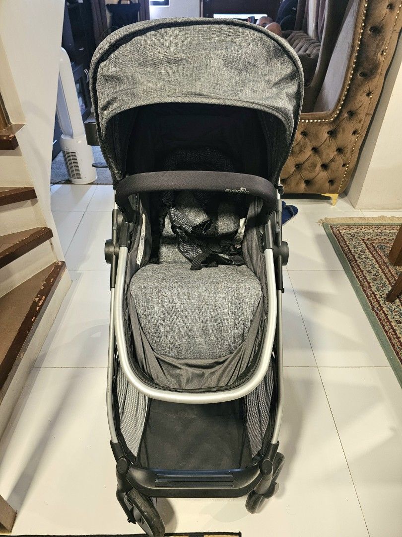 Evenflo Baby Stroller (Grey) (Category: Strollers) located in San Mateo. Submitted by authenticitemshere (Listing ID 1440773482, Image 1). Description: Bought in Canada. Used for a month only. RFS: nakastock lang. Mas preferred ni baby na nakasit lang. - Grey stroller with canopy - Adjustable handle for comfort - Spacious storage basket underneath - Secure 5-point safety harness - Convenient side cup holder - Ideal for daily walks and trips.