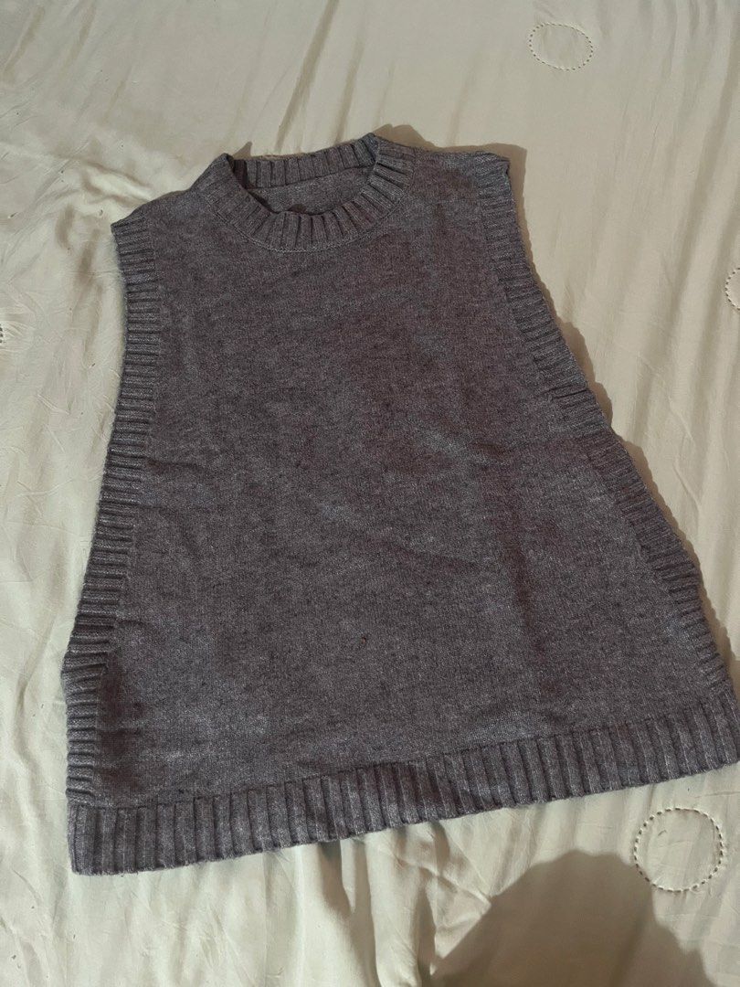 Grey Knit Sleeveless Sweater Vest (Category: Sleeveless) located in Antipolo. Submitted by tomale1 (Listing ID 1440800701, Image 1). Description: - Grey knit sweater vest - Sleeveless design - Ribbed hem and neckline - Ideal for layering - Adds warmth without bulk - Easy to style over shirts or dresses - Suitable for casual and smart-casual outfits.