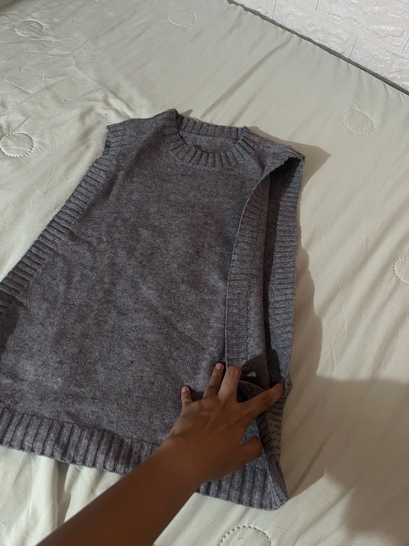 Grey Knit Sleeveless Sweater Vest (Category: Sleeveless) located in Antipolo. Submitted by tomale1 (Listing ID 1440800701, Image 3). Description: - Grey knit sweater vest - Sleeveless design - Ribbed hem and neckline - Ideal for layering - Adds warmth without bulk - Easy to style over shirts or dresses - Suitable for casual and smart-casual outfits.