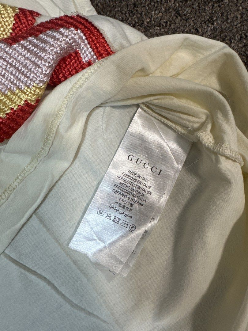 Gucci White Sequin Pig T-Shirt (Category: Shirts) located in Mandaluyong City. Submitted by krstls (Listing ID 1440819153, Image 3). Description: - Authentic White Gucci T-shirt - Features sparkling sequin details - Iconic Gucci logo and adorable pig graphic - Made in Italy - Perfect statement piece for any outfit.