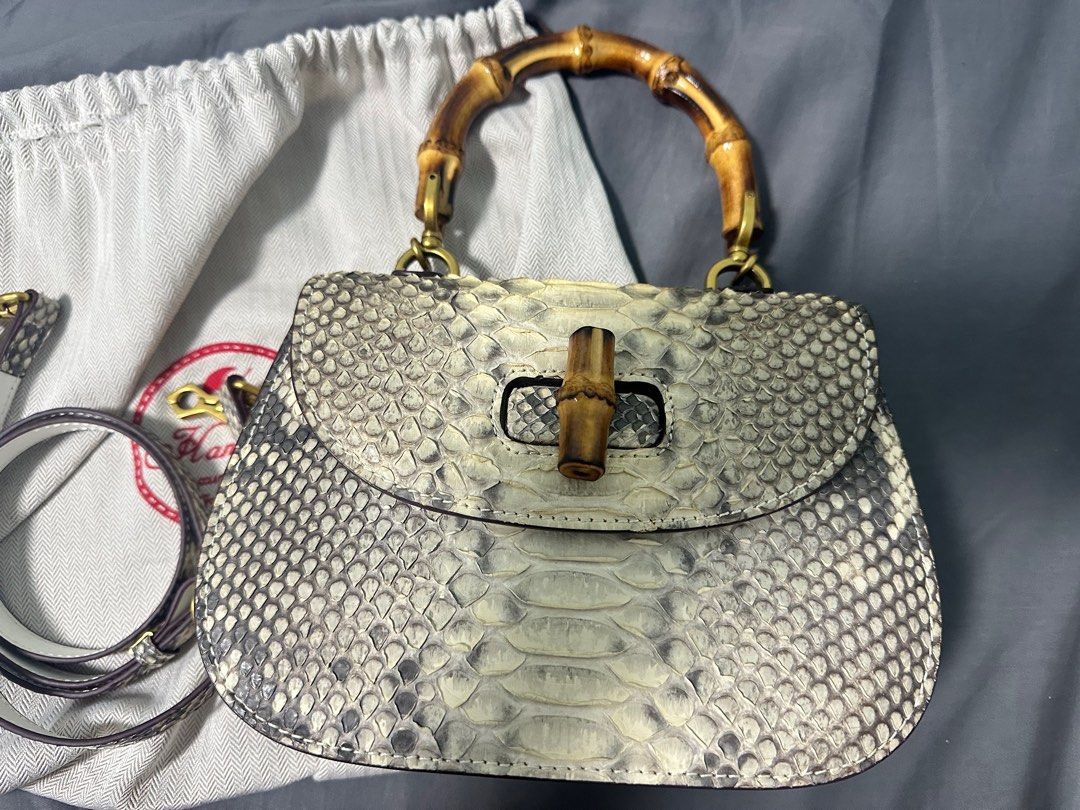 Handbag python leather bag (Category: Shoulder Bags) located in Singapore. Submitted by molan555 (Listing ID 1395117971, Image 1). Description: Original python leather bag, classic style, bamboo handle, cowhide lining.