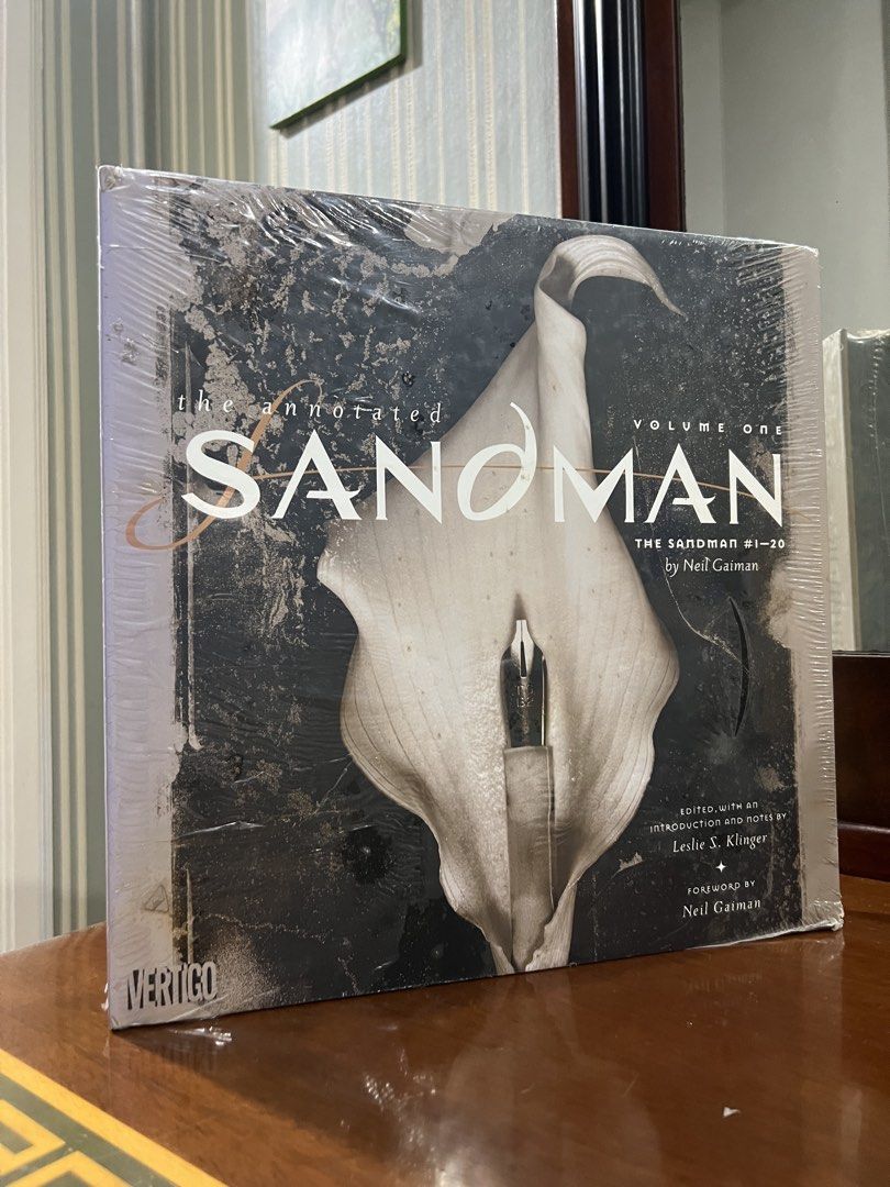 [HARDCOVER] The Annotated Sandman Vol. 1 DC Vertigo (Category: Comics & Manga) located in Manila. Submitted by jrlibrary (Listing ID 1440806041, Image 1). Description: - The Annotated Sandman Volume One - Collects The Sandman #1-20 - Edited with introduction and notes by Leslie S. Klinger - Foreword by Neil Gaiman - A literary classic in modern myth and dark fantasy - Perfect for fans of Neil Gaiman and comic history.